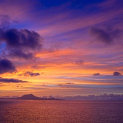 Pastel Skies Over Distant Shores