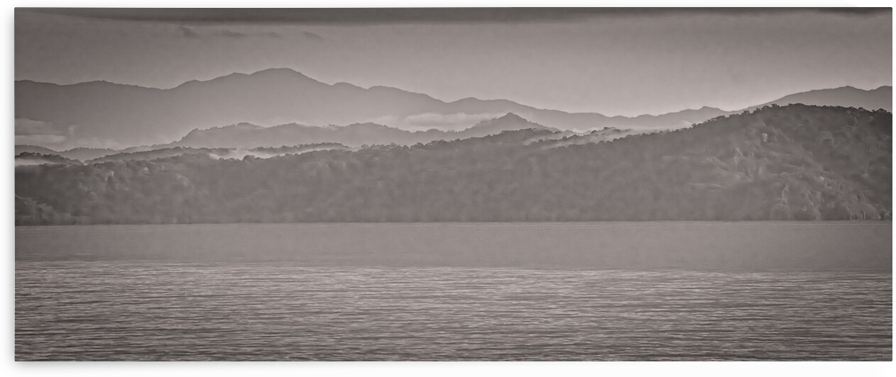 Mountain Silhouettes Over Still Water by Chirag Pandya